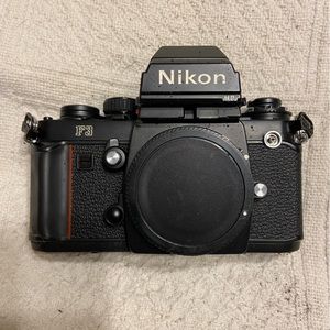 (2) Nikon F3 with Macro lens, light, zoom lens.